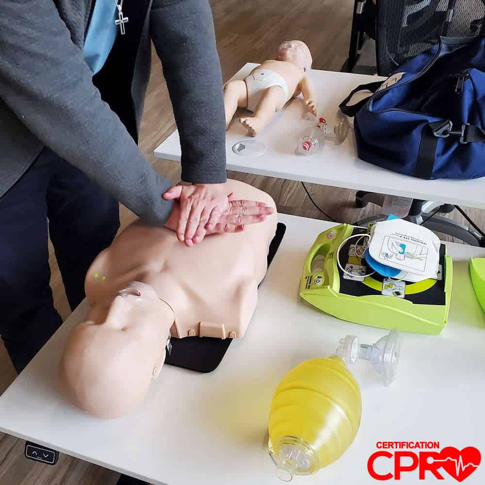 CPR training on mannequin for certification in Tallahassee.