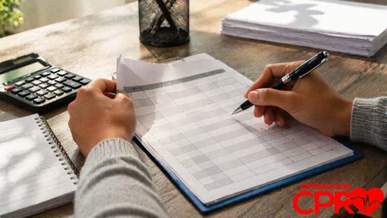 Person filling out a form for CPR certification in Tallahassee, Florida.